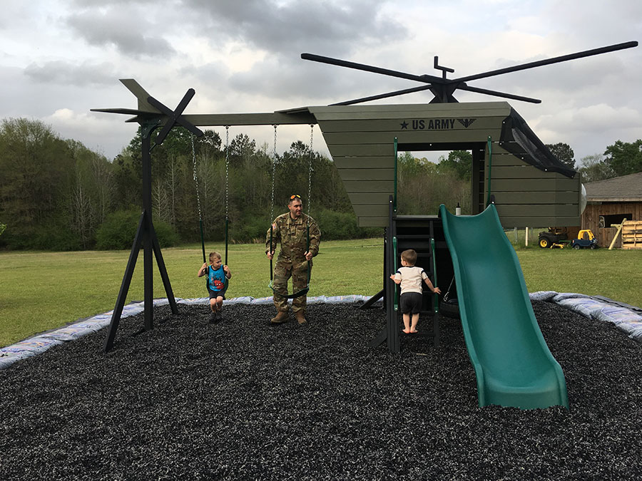 Army helicopter playground set with a military family