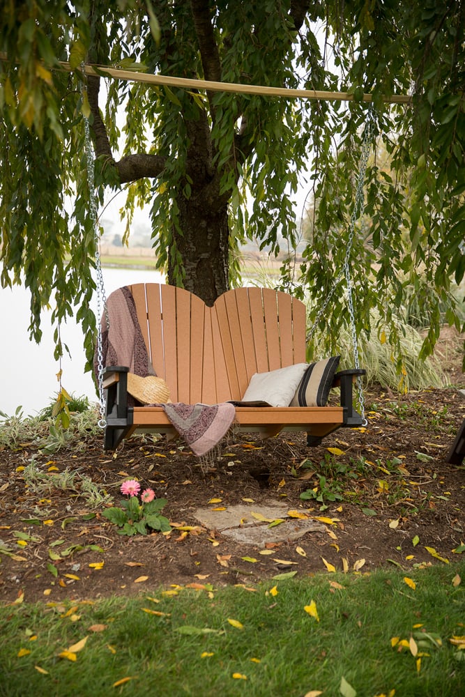 SeaAira Adirondack swing on a porch