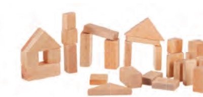Unfinished wooden building blocks stacked into a house and arches