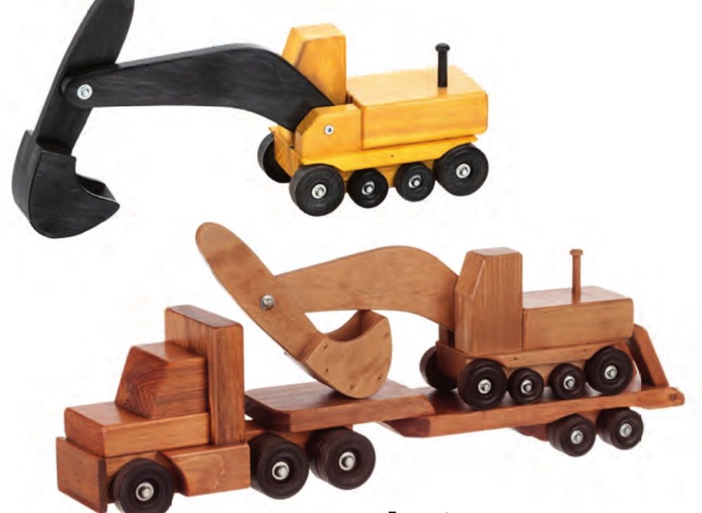 Wooden excavator riding on a Low Boy truck, with a yellow excavator above
